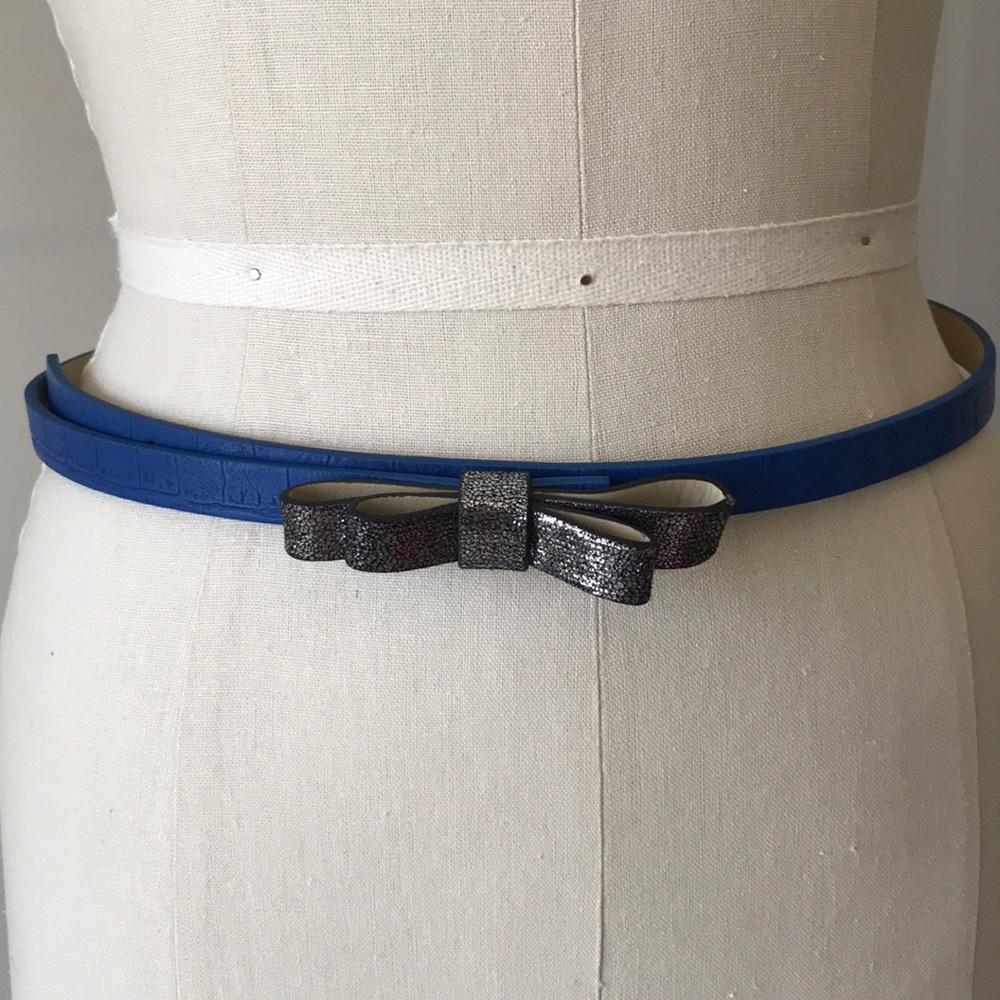 Blue leather with silver black bow tie belt.